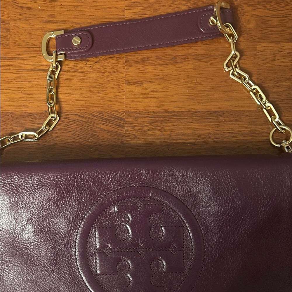 Tory Burch Plum/egg plant Leather Clutch with Gold Accents. - Picture 4 of 16